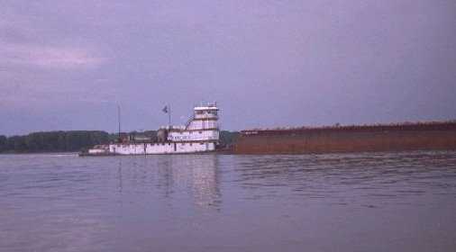 Barge navigating the Mississippi River.